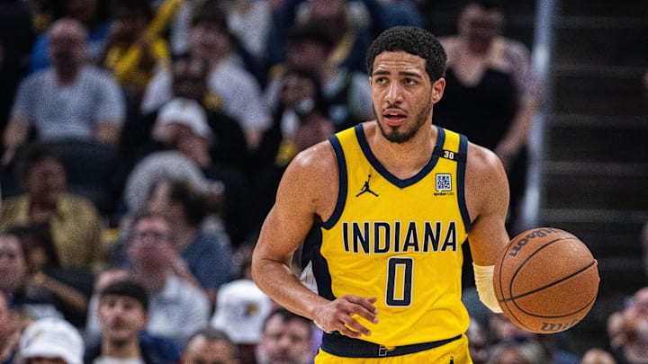 Apr 14, 2024; Indianapolis, Indiana, USA; Indiana Pacers guard Tyrese Haliburton (0) dribbles the