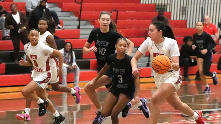 New Smyrna Beach's Olivia Olson (3) drives down court against River Ridge, Tuesday, Feb. 18, 2025 during Region 2-5A semifinals basketball action in New Smyrna Beach.