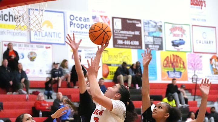 New Smyrna Beach's Olivia Olson (3) gets a shot off against River Ridge during the Region 2-5A semifinals last month. The Marshall commit last week poured in 30 points and grabbed 12 rebounds for a double-double and added four steals and four blocks to propel the Barracudas past Gainesville, 56-49, for the Class 5A state championship