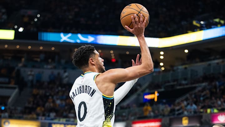 Apr 22, 2025; Indianapolis, Indiana, USA; Indiana Pacers guard Tyrese Haliburton (0) shoots the ball while Milwaukee Bucks center Brook Lopez (11) defends during game two of first round for the 2024 NBA Playoffs at Gainbridge Fieldhouse. Mandatory Credit: Trevor Ruszkowski-Imagn Images