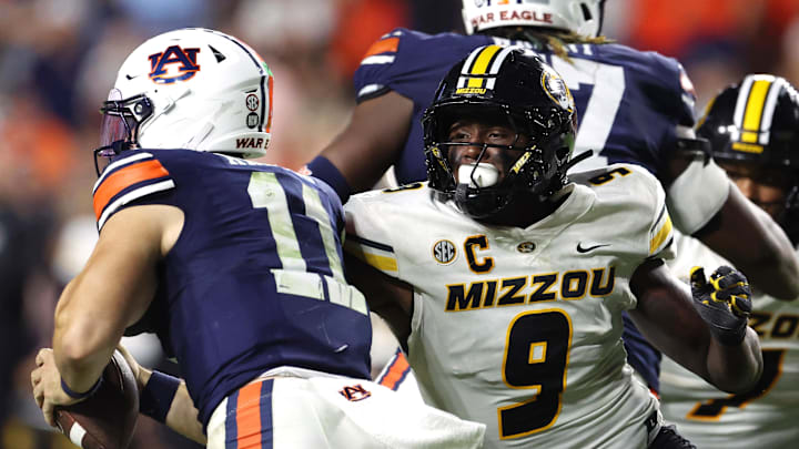 Oct 18, 2025; Auburn, Alabama, USA; Missouri Tigers defensive end Zion Young (9) moves in to tackle Auburn Tigers quarterback Jackson Arnold (11) during the fourth quarter at Jordan-Hare Stadium. Mandatory Credit: John Reed-Imagn Images Oct 18, 2025; Auburn, Alabama, USA; Missouri Tigers defensive end Zion Young (9) moves in to tackle Auburn Tigers quarterback Jackson Arnold (11) during the fourth quarter at Jordan-Hare Stadium. Mandatory Credit: John Reed-Imagn Images