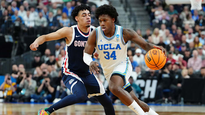 Mar 23, 2023; Las Vegas, NV, USA; UCLA Bruins guard David Singleton (34) dribbles the ball against Gonzaga Bulldogs guard Julian Strawther (0) during the first half at T-Mobile Arena. Mandatory Credit: Stephen R. Sylvanie-Imagn Images