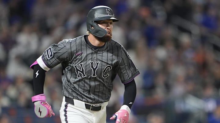 May 10, 2025; New York City, New York, USA; New York Mets left fielder Brandon Nimmo (9) runs out a single against the Chicago Cubs during the sixth inning at Citi Field. Mandatory Credit: Gregory Fisher-Imagn Images
