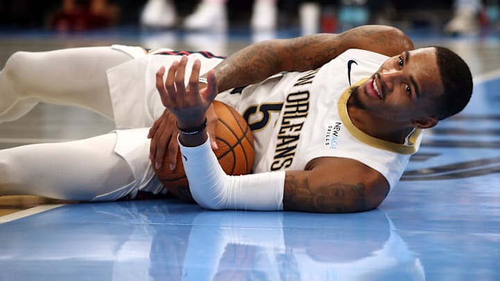 New Orleans Pelicans guard Dejounte Murray (5) reacts as he lays on the floor during the third quarter against the Memphis Grizzlies at FedExForum. Mandatory Credit: Petre Thomas-Imagn Images