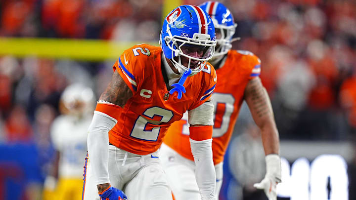 Jan 4, 2026; Denver, Colorado, USA; Denver Broncos cornerback Pat Surtain II (2) reacts to his tackle during the fourth quarter against the Los Angeles Chargers at Empower Field at Mile High. 