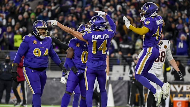 Nov 27, 2025; Baltimore, Maryland, USA;  Baltimore Ravens safety Kyle Hamilton (14) reacts after stopping Cincinnati Bengals on fourth down during the first half at M&T Bank Stadium. Mandatory Credit: Tommy Gilligan-Imagn Images