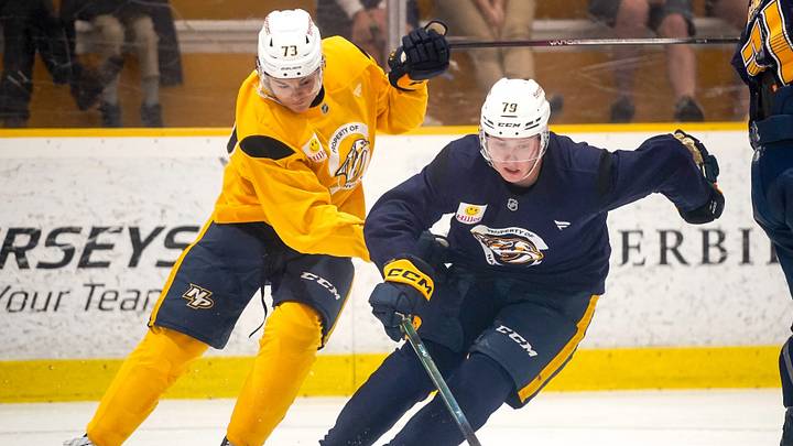 Gold team forward Ryker Lee (73) defends against Blue team forward Egor Surin (79) during the Future Stars Game at the Ford Ice Center Bellevue in Nashville, Tenn., Saturday, July 5, 2025.