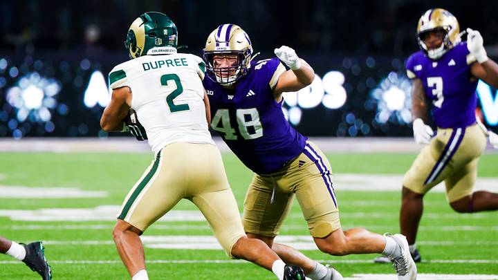 Aug 30, 2025; Seattle, Washington, USA; Washington Huskies edge Jacob Lane (48) tackles Colorado State Rams running back Jalen Dupree (2) during the fourth quarter at Husky Stadium. Mandatory Credit: Joe Nicholson-Imagn Images Aug 30, 2025; Seattle, Washington, USA; Washington Huskies edge Jacob Lane (48) tackles Colorado State Rams running back Jalen Dupree (2) during the fourth quarter at Husky Stadium. Mandatory Credit: Joe Nicholson-Imagn Images
