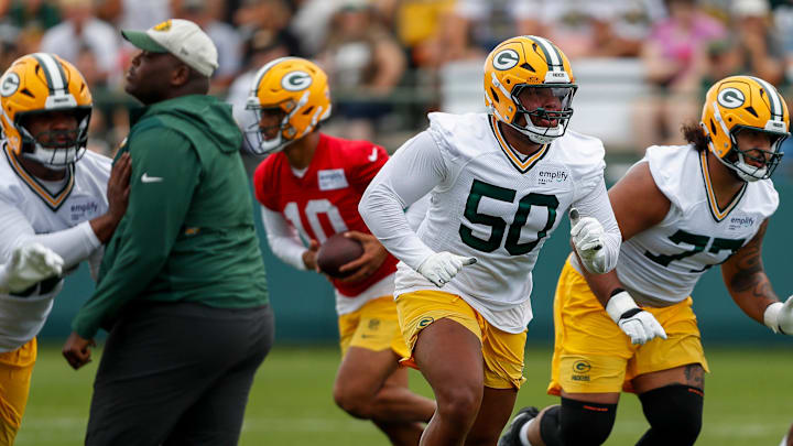 Green Bay Packers offensive tackle Zach Tom (50) runs through a drill during the first day of training camp on Wednesday, July 23, 2025, at Ray Nitschke Field in Ashwaubenon, Wis. 
Tork Mason/USA TODAY NETWORK-Wisconsin