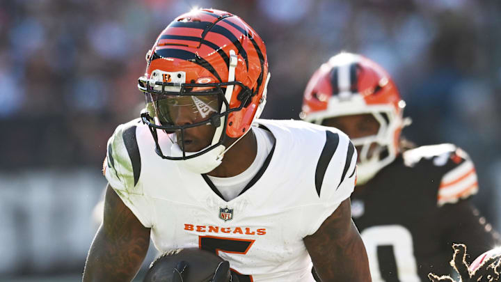 Oct 20, 2024; Cleveland, Ohio, USA; Cleveland Browns cornerback Martin Emerson Jr. (23) tackles Cincinnati Bengals wide receiver Tee Higgins (5) during the second half at Huntington Bank Field. Mandatory Credit: Ken Blaze-Imagn Images