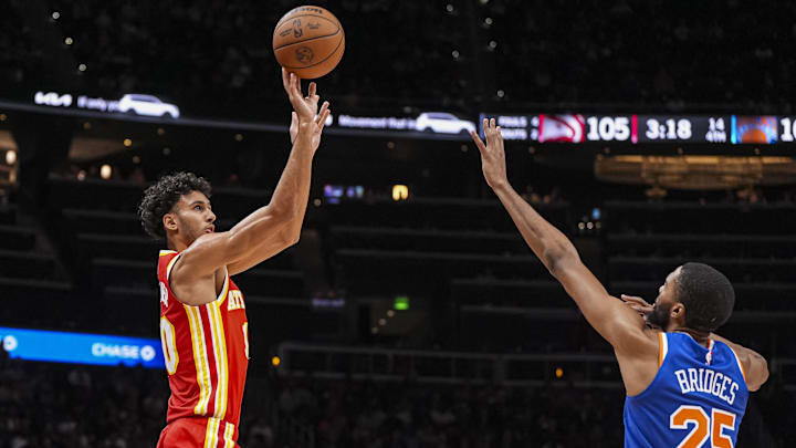 Nov 6, 2024; Atlanta, Georgia, USA; Atlanta Hawks forward Zaccharie Risacher (10) shoots over New York Knicks forward Mikal Bridges (25) during the second half at State Farm Arena. Mandatory Credit: Dale Zanine-Imagn Images Nov 6, 2024; Atlanta, Georgia, USA; Atlanta Hawks forward Zaccharie Risacher (10) shoots over New York Knicks forward Mikal Bridges (25) during the second half at State Farm Arena. Mandatory Credit: Dale Zanine-Imagn Images
