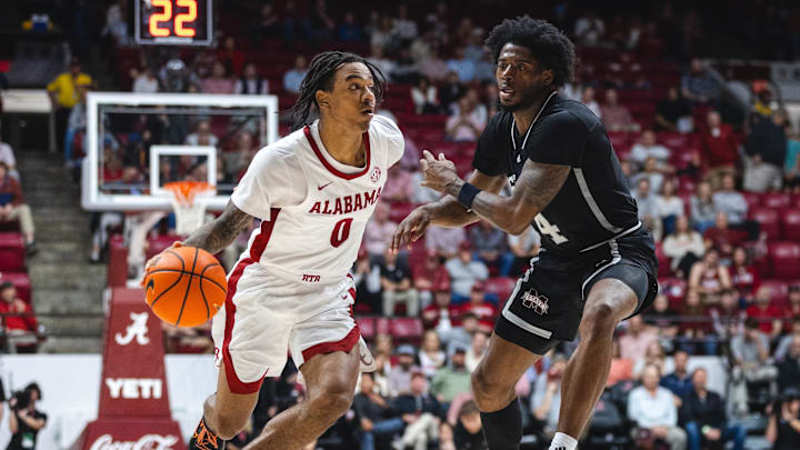 Feb 25, 2025; Tuscaloosa, Alabama, USA; Alabama Crimson Tide guard Labaron Philon (0) drives against Mississippi State Bulldogs forward Cameron Matthews (4) during the second half at Coleman Coliseum. Mandatory Credit: Will McLelland-Imagn Images Feb 25, 2025; Tuscaloosa, Alabama, USA; Alabama Crimson Tide guard Labaron Philon (0) drives against Mississippi State Bulldogs forward Cameron Matthews (4) during the second half at Coleman Coliseum. Mandatory Credit: Will McLelland-Imagn Images