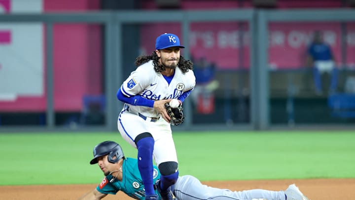 Sep 16, 2025; Kansas City, Missouri, USA; Seattle Mariners pinch runner Leo Rivas (76) slides into second base as Kansas City Royals second baseman Jonathan India (6) stops the ball during the top of the eighth inning at Kauffman Stadium. Mandatory Credit: Scott Sewell-Imagn Images