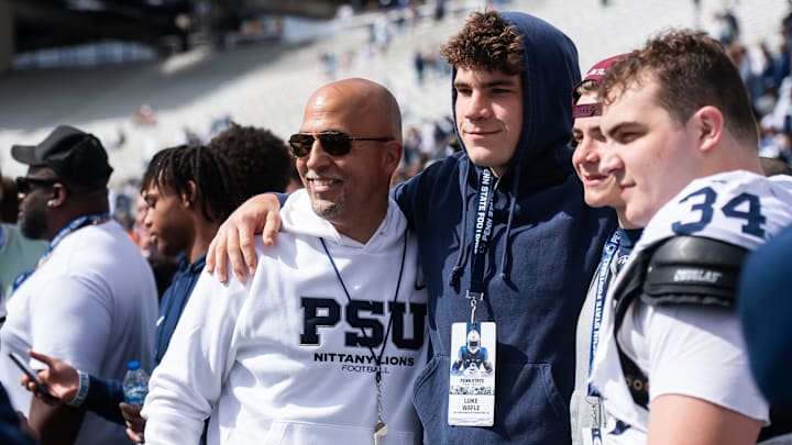 Penn State Nittany Lions' head coach James Franklin with recruit Luke Wafle and defensive tackle Owen Wafle.