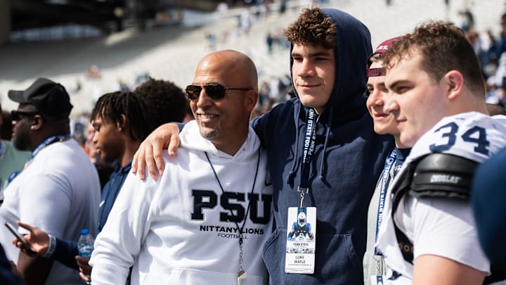 Penn State football head coach James Franklin takes a photo with recruit Luke Wafle and the Wafle family, including defensive tackle Owen Wafle (34), following the Blue-White game at Beaver Stadiu, in State College. The White team defeated the Blue team, 10-8.