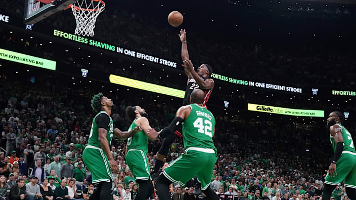 May 29, 2023; Boston, Massachusetts, USA; Miami Heat forward Jimmy Butler (22) shoots against Boston Celtics guard Derrick White (9) and guard Marcus Smart (36) and center Al Horford (42) in the second quarter during game seven of the Eastern Conference Finals for the 2023 NBA playoffs at TD Garden. Mandatory Credit: David Butler II-Imagn Images