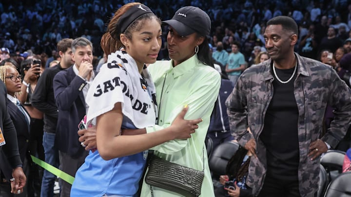 Jun 10, 2025; Brooklyn, New York, USA;  Chicago Sky forward Angel Reese (5) talks with former professional basketball player Lisa Leslie following the game against the New York Liberty at Barclays Center. Mandatory Credit: Wendell Cruz-Imagn Images