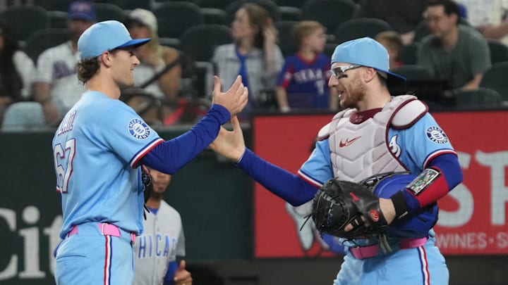 May 10, 2026; Arlington, Texas, USA;  Texas Rangers pitcher Jacob Latz (67) and catcher Danny Jansen (9) shake hands after defeating the Chicago Cubs at Globe Life Field. Mandatory Credit: Raymond Carlin III-Imagn Images