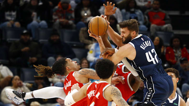 Jan 6, 2025; Memphis, Tennessee, USA; Memphis Grizzlies forward Brandon Clarke (15), forward Jaren Jackson Jr. (13) and Dallas Mavericks forward Maxi Kleber (42) battle for a rebound during the third quarter at FedExForum. Mandatory Credit: Petre Thomas-Imagn Images