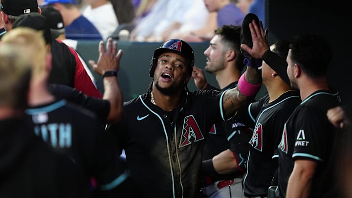 Jun 21, 2025; Denver, Colorado, USA; Arizona Diamondbacks second baseman Ketel Marte (4) celebrates scoring a run in the fourth inning against the Colorado Rockies at Coors Field. Mandatory Credit: Ron Chenoy-Imagn Images