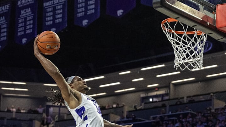 Kansas State Wildcats guard Nate Johnson dunks against California Golden Bears guard Justin Pippen. Mandatory Credit: Scott Sewell-Imagn Images