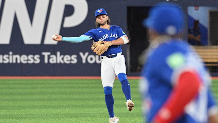 Jul 2, 2024; Toronto, Ontario, CAN; Toronto Blue Jays shortstop Bo Bichette (11) commits a throwing error on a ball hit by Houston Astros left fielder Yordan Alvarez (not shown) in the eighth inning at Rogers Centre. Mandatory Credit: Dan Hamilton-Imagn Images Jul 2, 2024; Toronto, Ontario, CAN; Toronto Blue Jays shortstop Bo Bichette (11) commits a throwing error on a ball hit by Houston Astros left fielder Yordan Alvarez (not shown) in the eighth inning at Rogers Centre. Mandatory Credit: Dan Hamilton-Imagn Images
