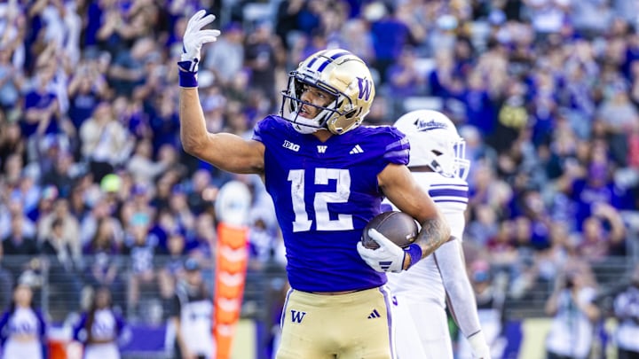 Sep 21, 2024; Seattle, Washington, USA; Washington Huskies wide receiver Denzel Boston (12) celebrates after catching a touchdown pass against the Northwestern Wildcats during the second quarter at Alaska Airlines Field at Husky Stadium. Mandatory Credit: Joe Nicholson-Imagn Images