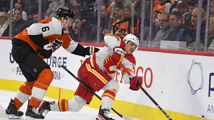Mar 4, 2025; Philadelphia, Pennsylvania, USA; Calgary Flames center Morgan Frost (16) battles with Philadelphia Flyers defenseman Travis Sanheim (6) during the second period at Wells Fargo Center. Mandatory Credit: Eric Hartline-Imagn Images Mar 4, 2025; Philadelphia, Pennsylvania, USA; Calgary Flames center Morgan Frost (16) battles with Philadelphia Flyers defenseman Travis Sanheim (6) during the second period at Wells Fargo Center. Mandatory Credit: Eric Hartline-Imagn Images