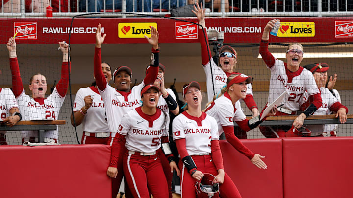 Oklahoma players celebrate after winning a replay challenge in the first inning during an NCAA softball game between the Oklahoma Sooners (OU) and the Tennessee Lady Volunteers at Love's Field in Norman, Okla., Friday, March 28, 2025.