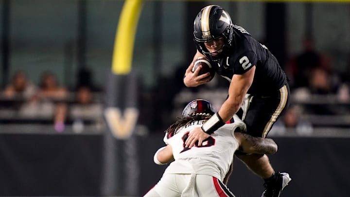 Vanderbilt quarterback Diego Pavia (2) tries to leap over Ball State defensive back Aj Taylor (16) during the third quarter at FirstBank Stadium in Nashville, Tenn., Saturday, Oct. 19, 2024. Vanderbilt quarterback Diego Pavia (2) tries to leap over Ball State defensive back Aj Taylor (16) during the third quarter at FirstBank Stadium in Nashville, Tenn., Saturday, Oct. 19, 2024.