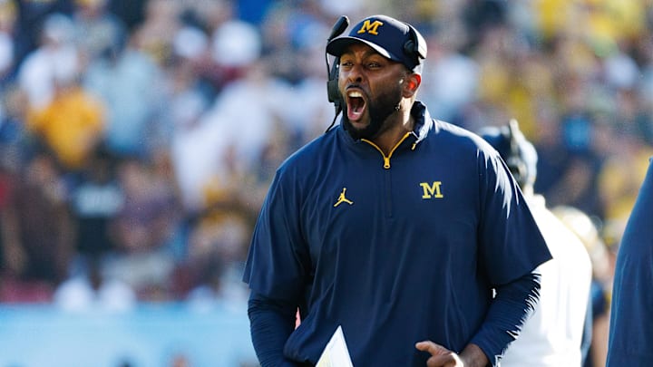 Dec 31, 2024; Tampa, FL, USA; Michigan Wolverines head coach Sherrone Moore screams from the sideline against the Alabama Crimson Tide during the second half at Raymond James Stadium. Mandatory Credit: Matt Pendleton-Imagn Images