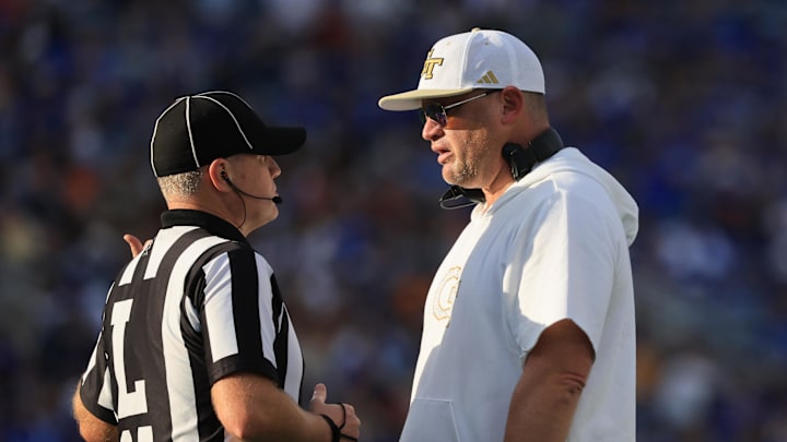 Dec 27, 2025; Orlando, FL, USA; Georgia Tech Yellow Jackets head coach Brent Key talks with the referee against the BYU Cougars during the first half at Camping World Stadium. Mandatory Credit: Kim Klement Neitzel-Imagn Images