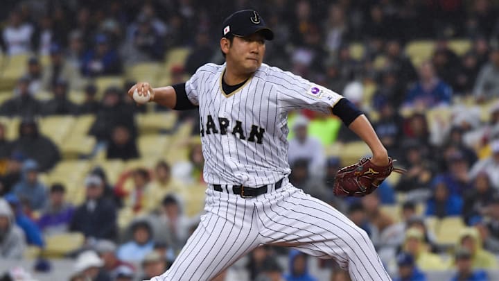 Mar 21, 2017; Los Angeles, CA, USA; Japan pitcher Tomoyuki Sugano (11) throws a pitch in the first inning against United States during the 2017 World Baseball Classic at Dodger Stadium.