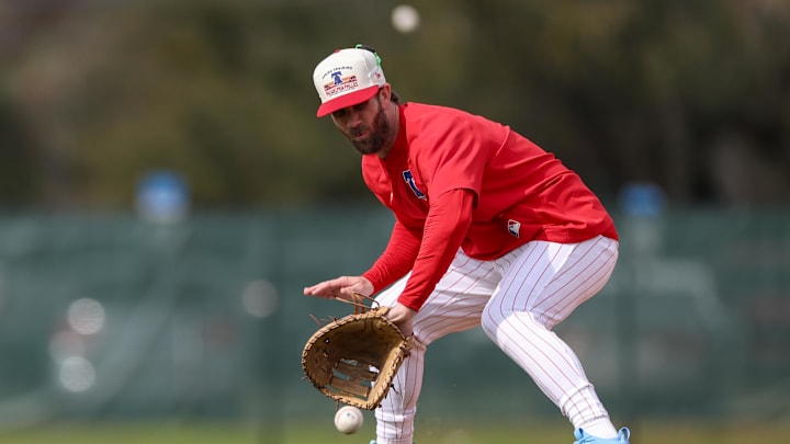 Philadelphia Phillies first base Bryce Harper (3) takes fielding practice during spring training workouts at BayCare Ballpark on Feb. 19.