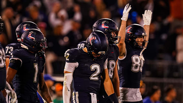 Nov 8, 2025; East Hartford, Connecticut, USA; UConn Huskies quarterback Joe Fagnano (2) with teammates after running the ball for a two point conversion against the Duke Blue Devils in the second half at Pratt & Whitney Stadium at Rentschler Field. Mandatory Credit: David Butler II-Imagn Images Nov 8, 2025; East Hartford, Connecticut, USA; UConn Huskies quarterback Joe Fagnano (2) with teammates after running the ball for a two point conversion against the Duke Blue Devils in the second half at Pratt & Whitney Stadium at Rentschler Field. Mandatory Credit: David Butler II-Imagn Images