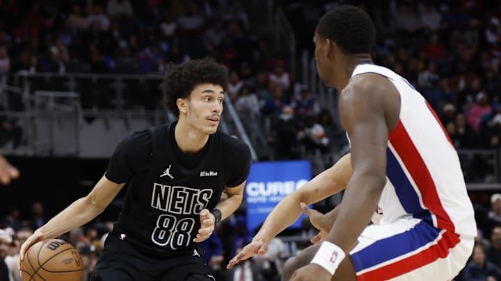 Feb 1, 2026; Detroit, Michigan, USA;  Brooklyn Nets guard Nolan Traore (88) dribbles defended by Detroit Pistons center Jalen Duren (0) in the first half at Little Caesars Arena. Mandatory Credit: Rick Osentoski-Imagn Images