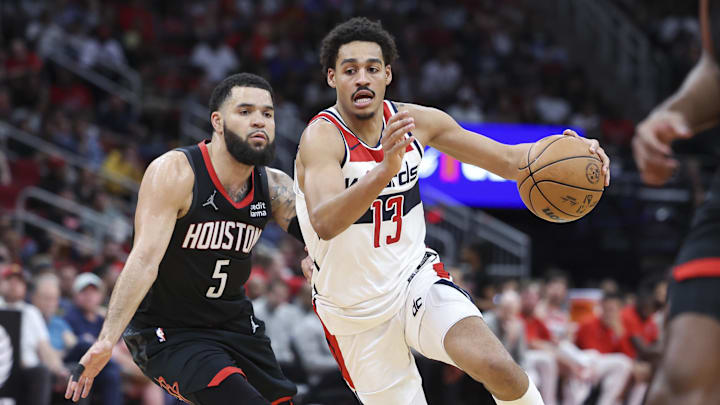 Mar 14, 2024; Houston, Texas, USA; Washington Wizards guard Jordan Poole (13) drives with the ball as Houston Rockets guard Fred VanVleet (5) defends during the third quarter at Toyota Center. Mandatory Credit: Troy Taormina-Imagn Images