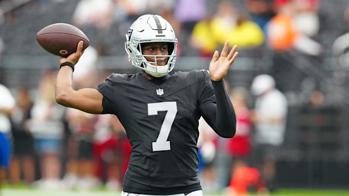 Aug 16, 2025; Paradise, Nevada, USA; Las Vegas Raiders quarterback Geno Smith (7) warms up before a preseason game against the San Francisco 49ers at Allegiant Stadium. Mandatory Credit: Stephen R. Sylvanie-Imagn Images