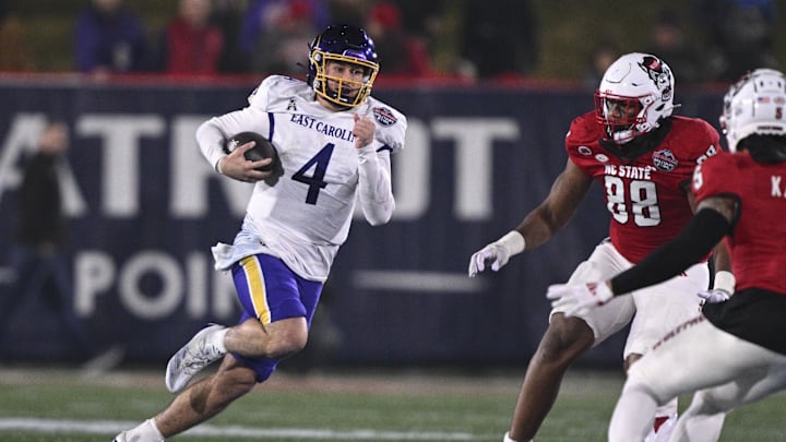 Dec 28, 2024; Annapolis, MD, USA; East Carolina Pirates quarterback Katin Houser (4) rushes during the second half of the Go Bowling Military Bowl against the North Carolina State Wolfpack at Navy-Marine Corps Memorial Stadium. Mandatory Credit: Tommy Gilligan-Imagn Images Dec 28, 2024; Annapolis, MD, USA; East Carolina Pirates quarterback Katin Houser (4) rushes during the second half of the Go Bowling Military Bowl against the North Carolina State Wolfpack at Navy-Marine Corps Memorial Stadium. Mandatory Credit: Tommy Gilligan-Imagn Images