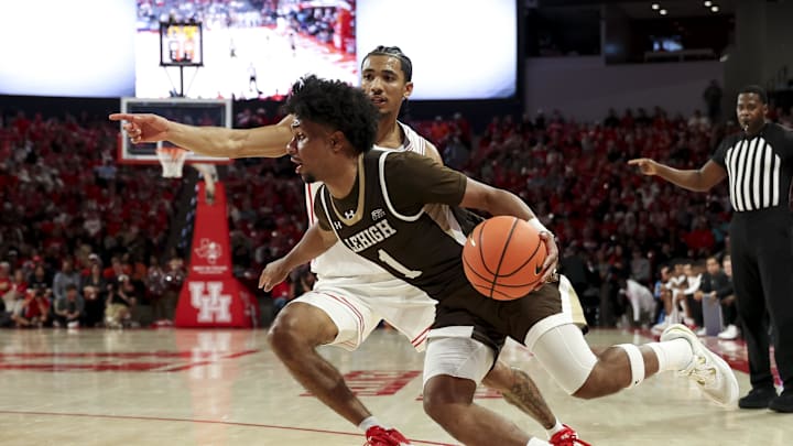 Nasir Whitlock (1) couldn’t solve national contender Houston in November, but had no trouble with Holy Cross in March.