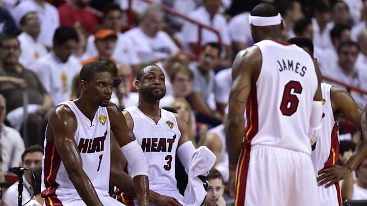 Jun 12, 2014; Miami, FL, USA; Miami Heat forward LeBron James (6) talks with center Chris Bosh (1), guard Dwyane Wade (3) during the second quarter of game four of the 2014 NBA Finals against the San Antonio Spurs at American Airlines Arena. Mandatory Credit: Bob Donnan-Imagn Images