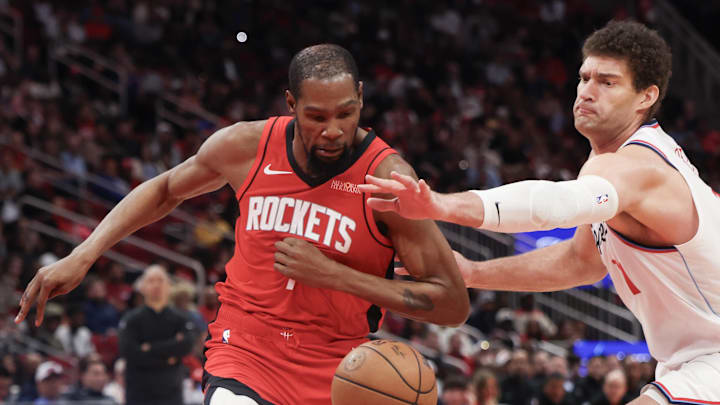 Feb 11, 2026; Houston, Texas, USA; Los Angeles Clippers center Brook Lopez (11) tries to steal the ball from Houston Rockets forward Kevin Durant (7) in the second half at Toyota Center. Mandatory Credit: Thomas Shea-Imagn Images