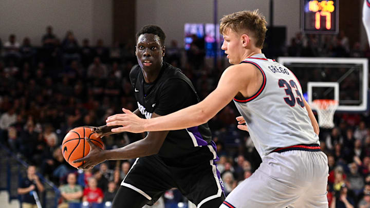 Portland Pilots forward Bol Dengdit and Gonzaga Bulldogs forward Ben Gregg.