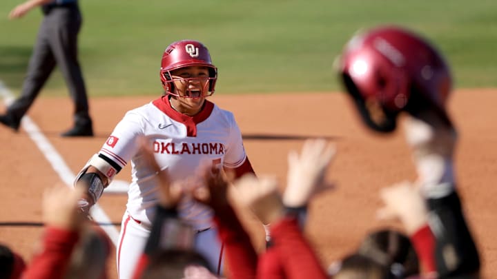Oklahoma infielder Ella Parker (5) runs home after hitting a home run in the first inning of a Big 12 Softball Championship semifinal game against BYU on Friday afternoon.