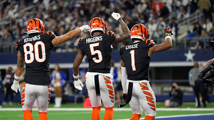 Cincinnati Bengals wide receiver Andrei Iosivas (80), wide receiver Tee Higgins (5) and wide receiver Ja'Marr Chase (1) dance after Chase’s touchdown in the 4th quarter that gave them the victory over Dallas Cowboys during Monday Night Football at AT&T Stadium in Arlington,Texas on Monday, December 9, 2024. The Bengals won 27-20. Cincinnati Bengals wide receiver Andrei Iosivas (80), wide receiver Tee Higgins (5) and wide receiver Ja'Marr Chase (1) dance after Chase’s touchdown in the 4th quarter that gave them the victory over Dallas Cowboys during Monday Night Football at AT&T Stadium in Arlington,Texas on Monday, December 9, 2024. The Bengals won 27-20.