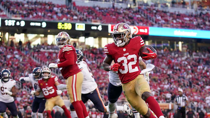 Dec 8, 2024; Santa Clara, California, USA; San Francisco 49ers running back Patrick Taylor Jr. (32) runs the ball against the Chicago Bears in the fourth quarter at Levi's Stadium. Mandatory Credit: Cary Edmondson-Imagn Images