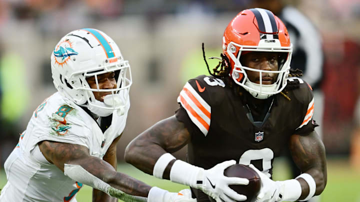 Cleveland Browns wide receiver Jerry Jeudy runs with the ball after a catch as Miami Dolphins safety Jevon Holland trails.
