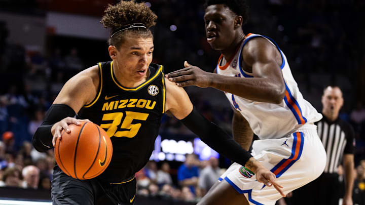 Feb 28, 2024; Gainesville, Florida, USA; Missouri Tigers forward Noah Carter (35) drives to the basket past Florida Gators forward Tyrese Samuel (4) during the first half at Exactech Arena at the Stephen C. O'Connell Center. Mandatory Credit: Matt Pendleton-Imagn Images