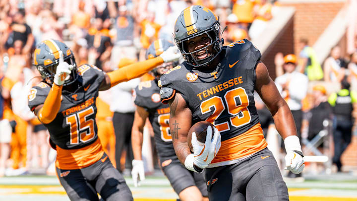 Tennessee defensive lineman Jordan Ross (29) returns a block punted for a touchdown during Tennessee's game against Chattanooga in Neyland Stadium in Knoxville on Saturday, Aug. 31, 2024.