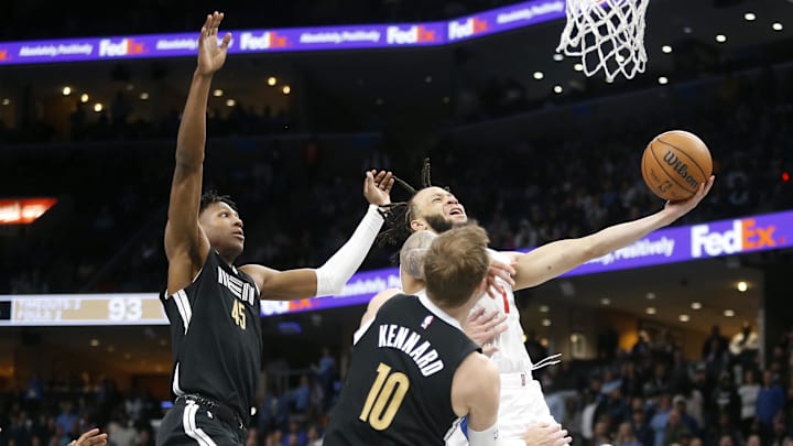 Feb 23, 2024; Memphis, Tennessee, USA; Los Angeles Clippers guard Amir Coffey (7) drives to the rim against Memphis. 